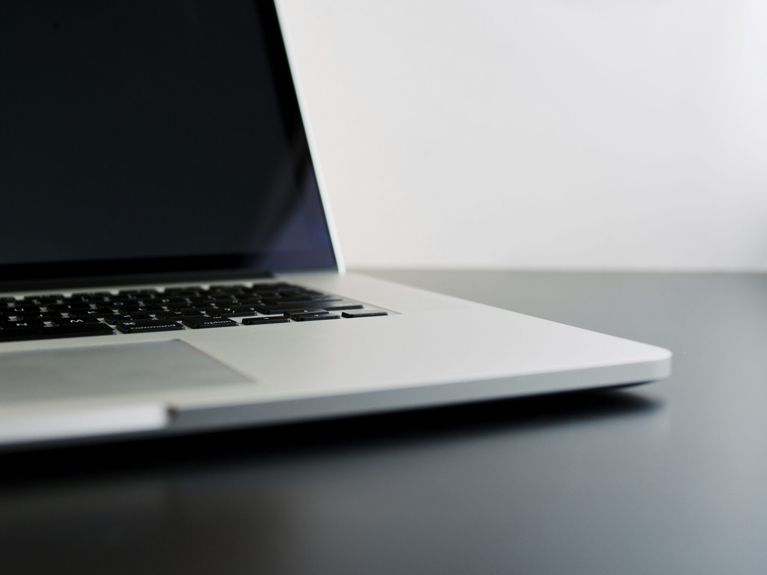 silver laptop computer on black table https://unsplash.com/photos/silver-laptop-computer-on-black-table-WB3ujiKLJwQ