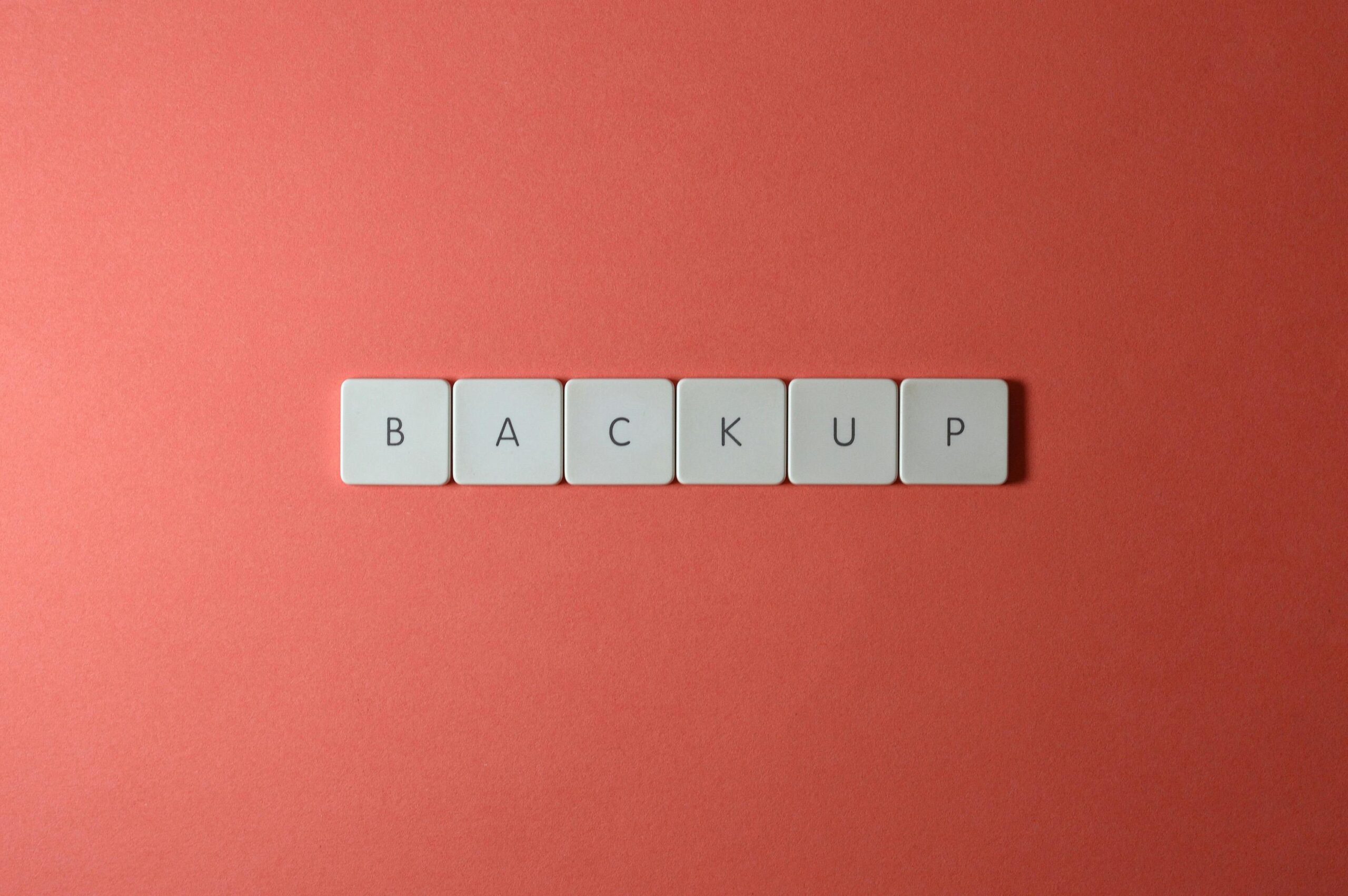 Free Close-up of keyboard keys spelling 'BACKUP' placed on a coral-colored surface. Stock Photo https://www.pexels.com/photo/close-up-shot-of-keyboard-buttons-2882506/
