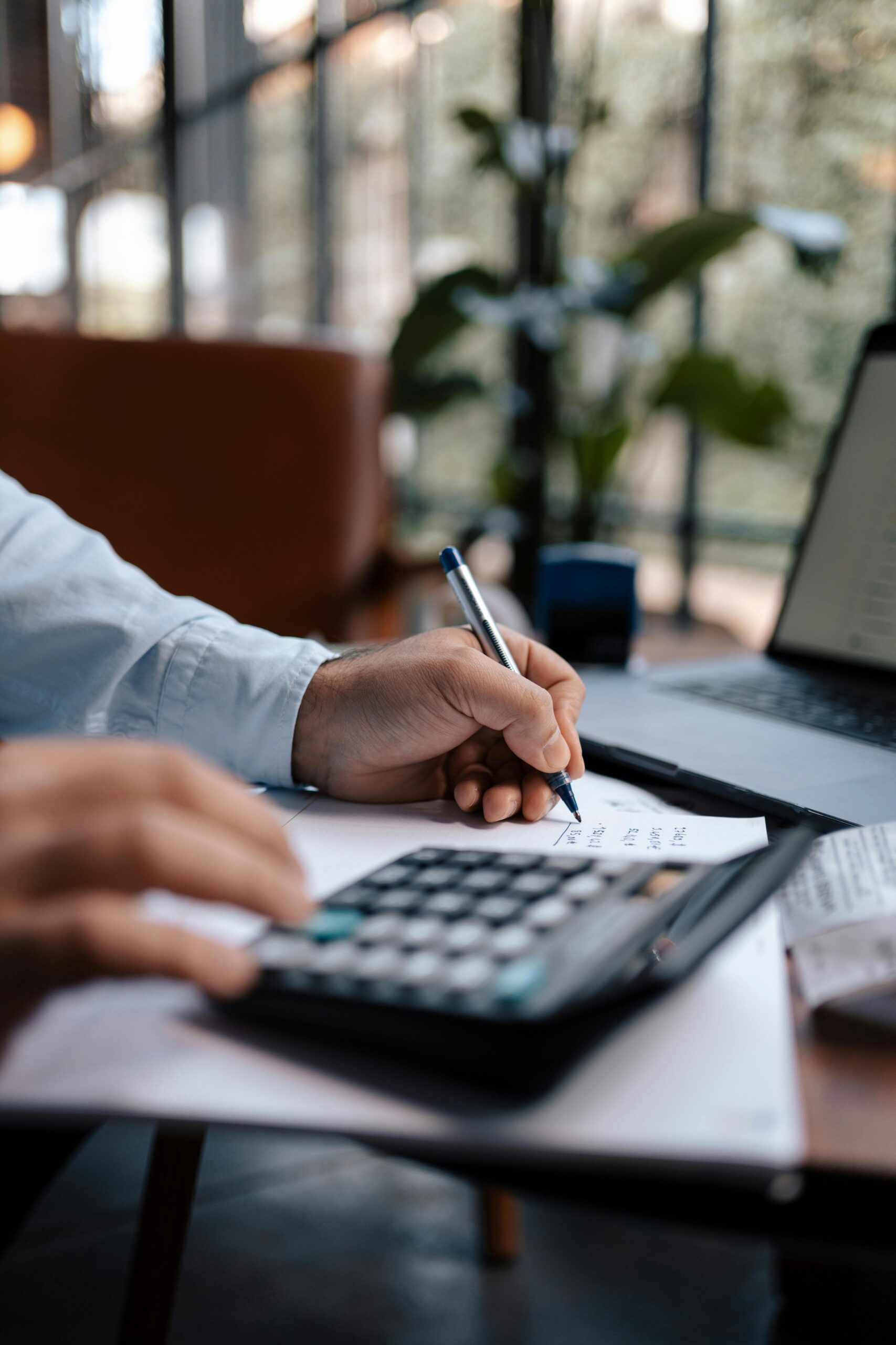 Free A person calculating finances with a calculator and pen on a desk indoors. Stock Photo Photo by Mohamed hamdi: https://www.pexels.com/photo/a-person-using-a-calculator-16282306/