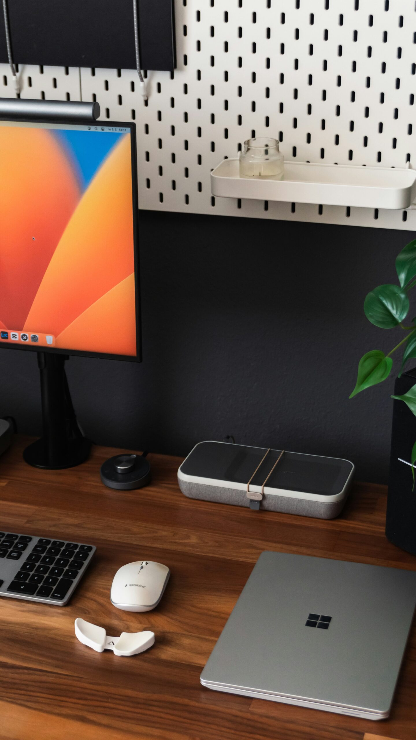 a desk with a laptop, keyboard, mouse and a monitor Photo by Matúš Gocman on Unsplash