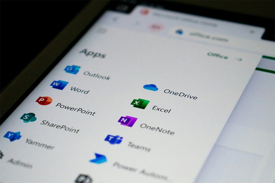 a computer screen showing all the microsoft 365 apps, featuring onedrive and sharepoint. Photo by Ed Hardie on Unsplash