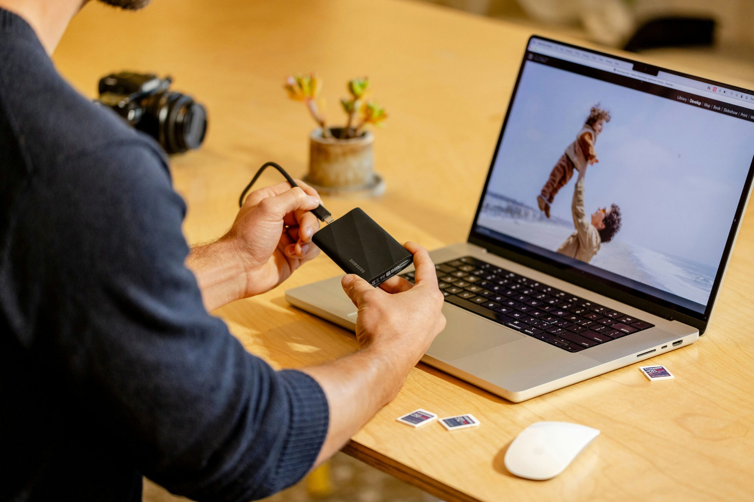 A man sitting at a table with a laptop and cell phone https://unsplash.com/photos/a-man-sitting-at-a-table-with-a-laptop-and-cell-phone-pz67hBsfbJ4