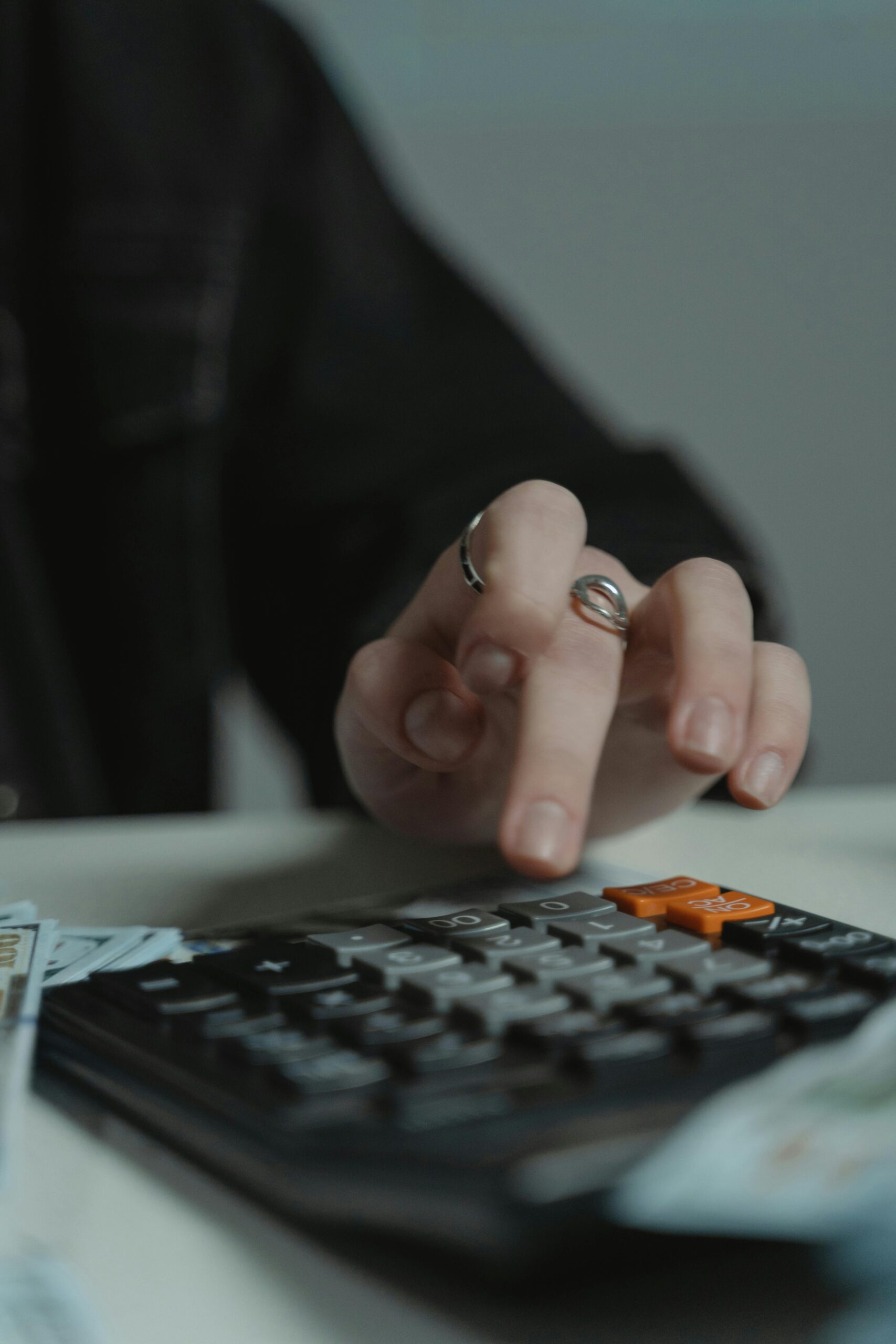 https://www.pexels.com/photo/person-using-a-calculator-on-the-table-6266276/